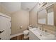 A bathroom featuring a toilet, a wood-look floor, and a vanity with a square-style sink at 8310 Brickle Ln, Huntersville, NC 28078