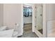 Modern bathroom featuring a glass enclosed shower and a walk-in closet with wood floor at 8310 Brickle Ln, Huntersville, NC 28078
