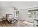 Bright bedroom with ceiling fan, natural light and stylish wood-look flooring at 8310 Brickle Ln, Huntersville, NC 28078