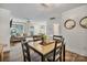 Cozy dining area blends into living space with light wood table and shiplap walls at 8310 Brickle Ln, Huntersville, NC 28078