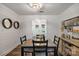Traditional dining room featuring shiplap walls, wood floors, modern lighting, and a vintage style buffet at 8310 Brickle Ln, Huntersville, NC 28078