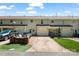 Charming townhome featuring a car, garages, patios, and backyards at 8310 Brickle Ln, Huntersville, NC 28078
