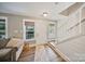 Bright foyer featuring hardwood floors, staircase, and abundant natural light from the windows at 8310 Brickle Ln, Huntersville, NC 28078