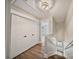 Bright hallway features linen closet and leads to a bedroom with wood-look flooring at 8310 Brickle Ln, Huntersville, NC 28078
