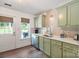 Kitchen featuring stainless steel appliances, herringbone backsplash and an exterior door at 8310 Brickle Ln, Huntersville, NC 28078