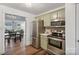 Charming kitchen with stainless steel appliances and view to dining space at 8310 Brickle Ln, Huntersville, NC 28078