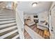Open-concept living room showcasing stylish fireplace, hardwood flooring, and ample natural light at 8310 Brickle Ln, Huntersville, NC 28078