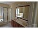 Bathroom featuring a double sink vanity, shower, and a soaking tub at 9228 Old Barnette Pl, Huntersville, NC 28078