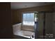 Bright bathroom features a large soaking tub and glass enclosed shower at 9228 Old Barnette Pl, Huntersville, NC 28078