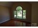 Bedroom with hardwood floors and a large window at 9228 Old Barnette Pl, Huntersville, NC 28078