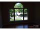 Bedroom with hardwood floors and a large window at 9228 Old Barnette Pl, Huntersville, NC 28078