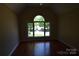 Bedroom with hardwood floors and a large window at 9228 Old Barnette Pl, Huntersville, NC 28078