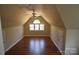 Spacious bonus room with neutral colored walls and a ceiling fan with light fixture at 9228 Old Barnette Pl, Huntersville, NC 28078