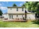Well-maintained home backyard featuring a wood deck, outdoor seating, and a grill at 9808 Steed Ct, Charlotte, NC 28269