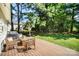Spacious backyard deck with outdoor seating, lush lawn, and serene wooded backdrop, ideal for relaxation at 9808 Steed Ct, Charlotte, NC 28269