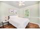 Comfortable bedroom with hardwood floors, a large window, and neutral decor, creating a serene space at 9808 Steed Ct, Charlotte, NC 28269