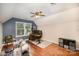 Bright bonus room with hardwood floors, a ceiling fan, and natural light perfect for hobbies at 9808 Steed Ct, Charlotte, NC 28269