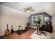 Inviting bonus room featuring hardwood floors, a ceiling fan, and ample space for creativity at 9808 Steed Ct, Charlotte, NC 28269