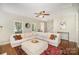 Inviting living room with a sectional sofa, hardwood floors, and natural light at 9808 Steed Ct, Charlotte, NC 28269