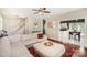 Spacious living room with a sectional sofa, view into kitchen, and wood floors at 9808 Steed Ct, Charlotte, NC 28269