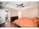 Spacious primary bedroom with a trey ceiling, hardwood floors, dresser, and an ensuite bathroom at 9808 Steed Ct, Charlotte, NC 28269