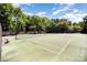 Well-maintained tennis courts offer a great recreational amenity for active homeowners to enjoy year round at 9808 Steed Ct, Charlotte, NC 28269