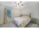Bright bedroom with a comfortable bed, a window, and a green bedside table at 1003 Cranberry Cir, Fort Mill, SC 29715