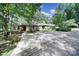 Attractive home featuring a spacious driveway and lush landscaping at 1003 Cranberry Cir, Fort Mill, SC 29715