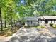 Beautiful home showcasing mature trees and landscaping at 1003 Cranberry Cir, Fort Mill, SC 29715