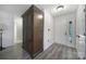 Spacious foyer with sleek wood laminate flooring and a decorative armoire, adjacent to the front door at 1003 Cranberry Cir, Fort Mill, SC 29715