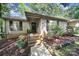 Inviting front entrance featuring brick steps, dark shutters, and landscaped garden beds for an attractive curb appeal at 1003 Cranberry Cir, Fort Mill, SC 29715