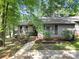 Charming single story home with a well maintained yard and mulched flower beds with stone border at 1003 Cranberry Cir, Fort Mill, SC 29715