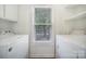 Convenient laundry room with washer and dryer hookups and a window for natural light at 1003 Cranberry Cir, Fort Mill, SC 29715