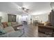 Spacious living area showcasing modern laminate floors, an open layout, and access to the dining room and entry at 1003 Cranberry Cir, Fort Mill, SC 29715