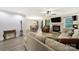 Open concept living space with laminate flooring, fireplace, and dining area creating a comfortable and inviting atmosphere at 1003 Cranberry Cir, Fort Mill, SC 29715
