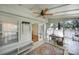 Bright sunroom with multiple windows, desk space, and a unique built-in storage bench at 1003 Cranberry Cir, Fort Mill, SC 29715