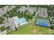Community aerial view featuring the pool, tennis courts, clubhouse, and surrounding homes at 1009 Hercules Dr, Indian Trail, NC 28079