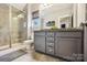Bathroom features a large tiled shower, modern vanity, and ample lighting at 1009 Hercules Dr, Indian Trail, NC 28079