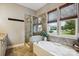 Bathroom with tub, stand-alone shower, and natural light at 1009 Hercules Dr, Indian Trail, NC 28079