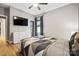 Comfortable bedroom features wood floors, and abundant natural light at 1009 Hercules Dr, Indian Trail, NC 28079