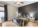 Cozy bedroom with wood floors, ceiling fan, and stylish accent wall at 1009 Hercules Dr, Indian Trail, NC 28079