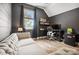 Cozy bedroom features a modern workspace, comfortable couch, and ample natural light at 1009 Hercules Dr, Indian Trail, NC 28079