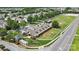 Aerial of a community stable with horse paddocks, manicured lawns, and ample parking at 1009 Hercules Dr, Indian Trail, NC 28079