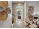 Bright foyer features wood floors, Gathering decor, arched entry, and a view of the front door leading to the landscaped yard at 1009 Hercules Dr, Indian Trail, NC 28079