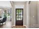 Bright foyer features a glass-paneled front door with views into the dining room and beyond at 1009 Hercules Dr, Indian Trail, NC 28079