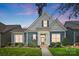 Charming blue two-story home with a landscaped front yard, inviting entry, and lovely flower boxes beneath the windows at 1009 Hercules Dr, Indian Trail, NC 28079