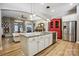 Open-concept kitchen with a spacious island, stainless steel appliances, and views into the living area at 1009 Hercules Dr, Indian Trail, NC 28079