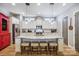 Bright kitchen boasts granite counters, stainless appliances, island with seating, and ample cabinet space at 1009 Hercules Dr, Indian Trail, NC 28079