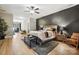Spacious bedroom with wood floors, ceiling fan, seating area, and stylish decor at 1009 Hercules Dr, Indian Trail, NC 28079
