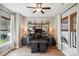 Bright office space featuring custom shelves, desks, and a ceiling fan at 1009 Hercules Dr, Indian Trail, NC 28079